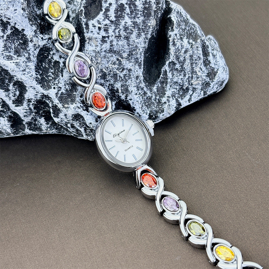 Oval watch with gemstones and diamonds