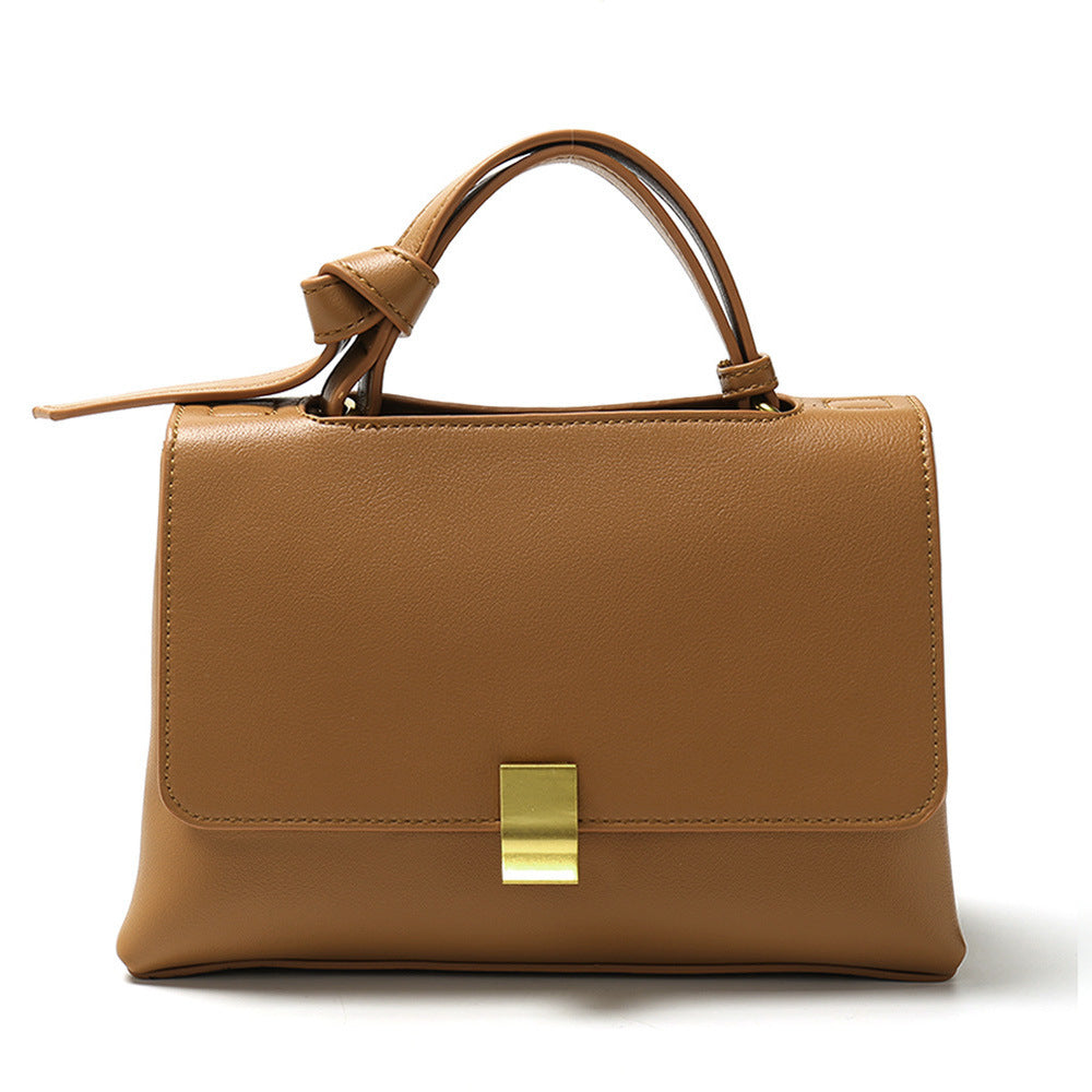 Simple solid color handbag with a slouchy shoulder strap