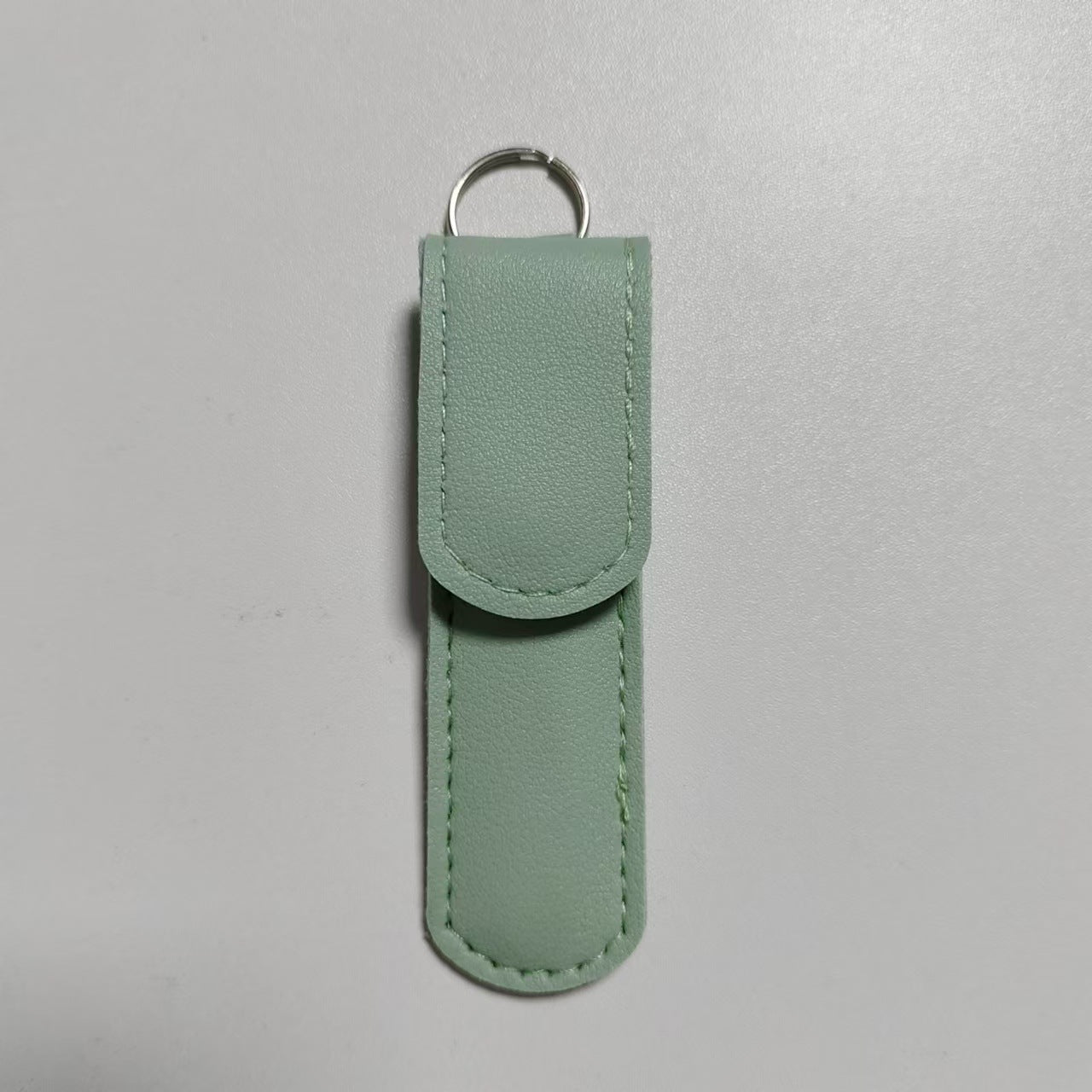 Stainless steel round-head press-type nasal hair clip