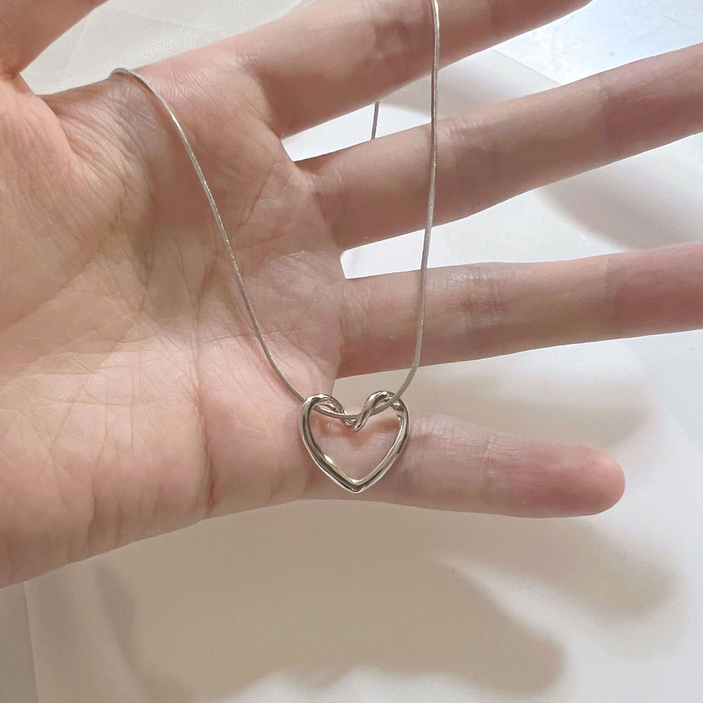 Twisted Heart Titanium Steel Necklace with Snake Chain