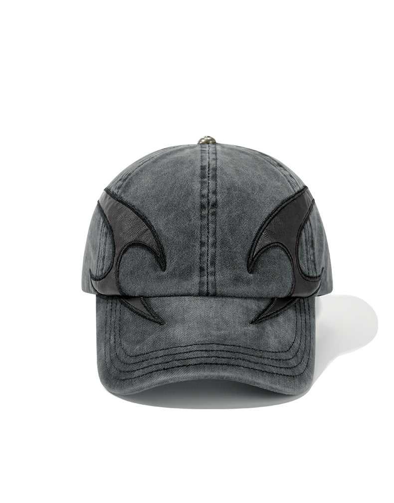 Washed and distressed denim baseball cap