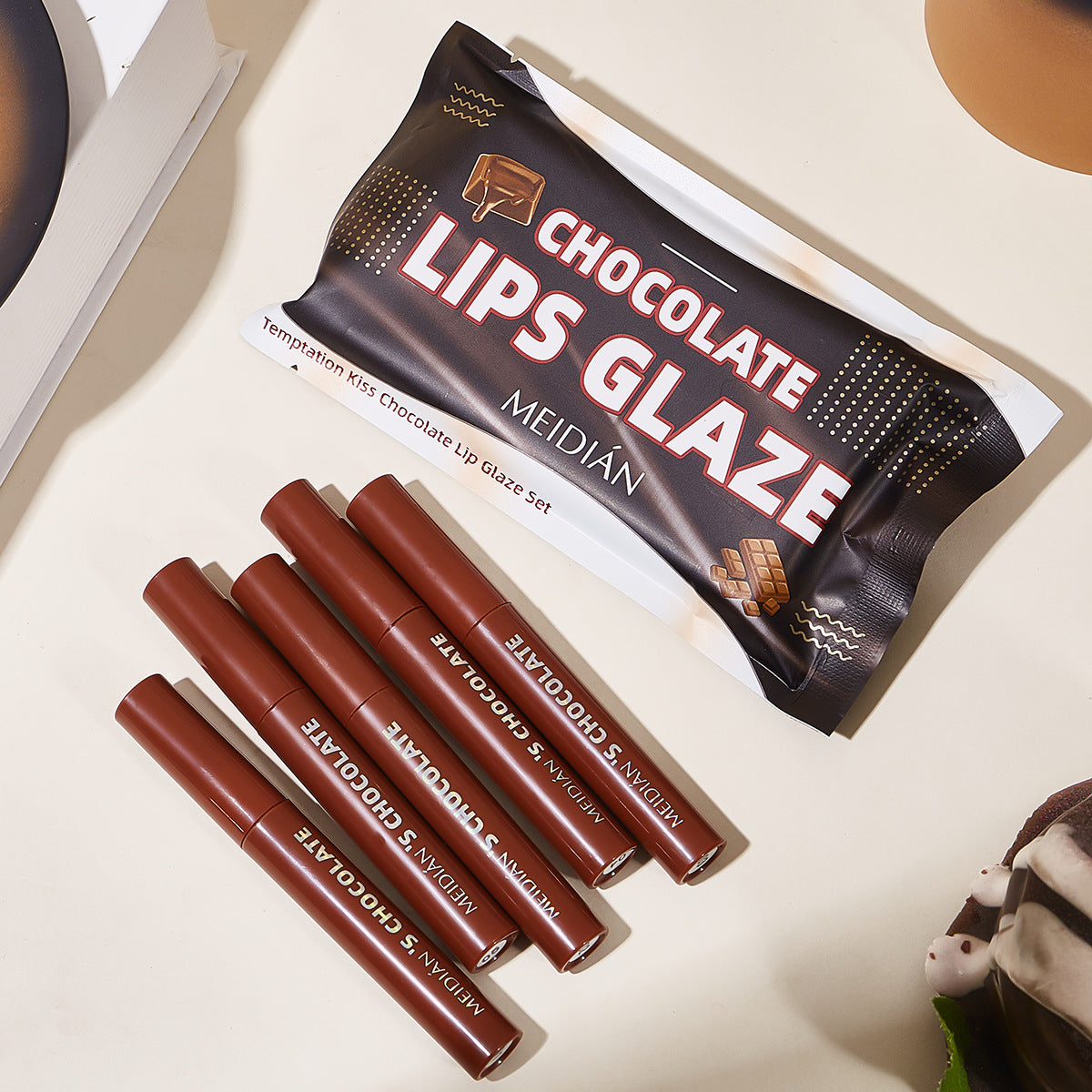 5-piece set of chocolate lip gloss with matte and glossy finish and satin texture