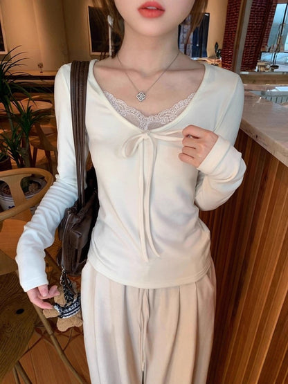 A beige lace V-neck top paired