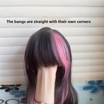 A female wig with pink and black highlights and long curly hair