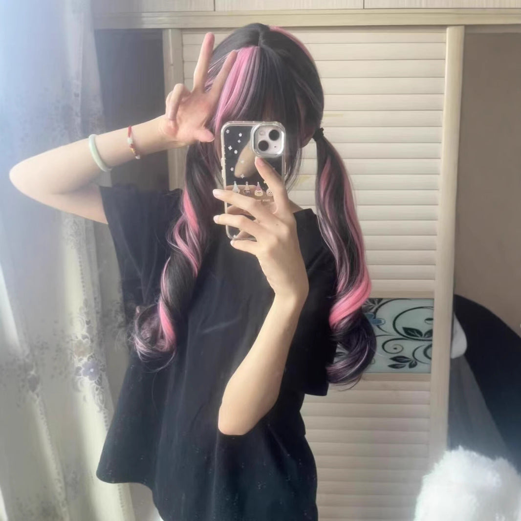 A female wig with pink and black highlights and long curly hair
