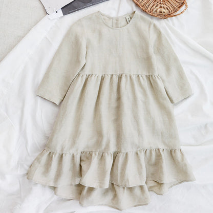 A girl's cotton and linen dress with an irregular hem