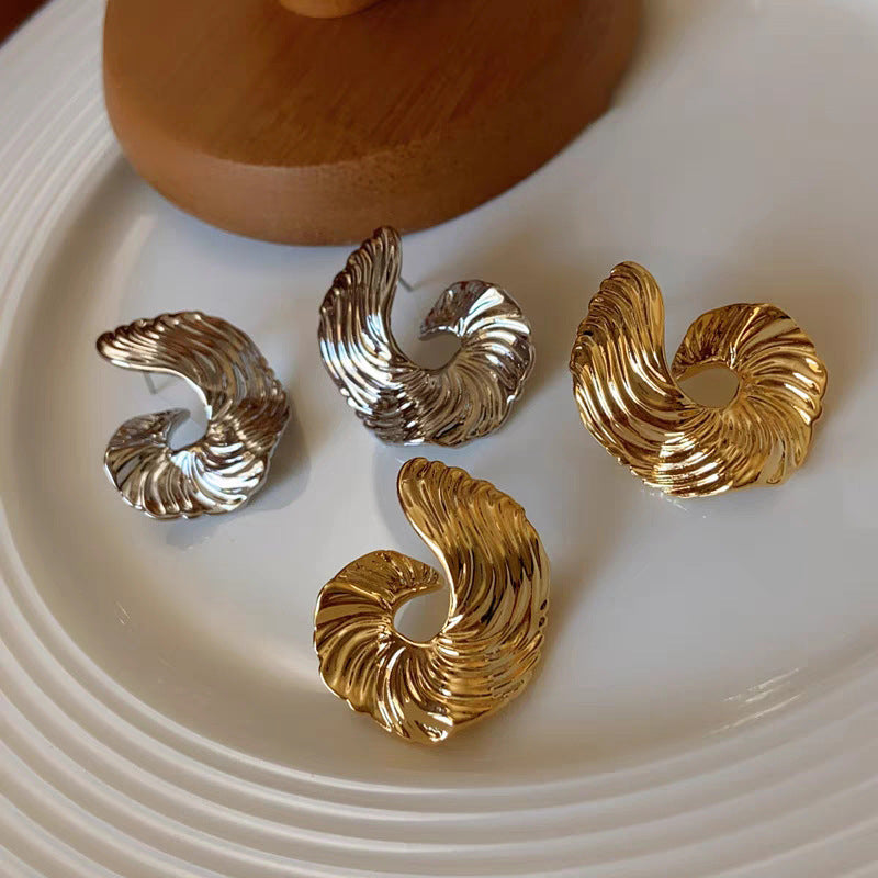 A girl with a unique and distinctive design of ear studs