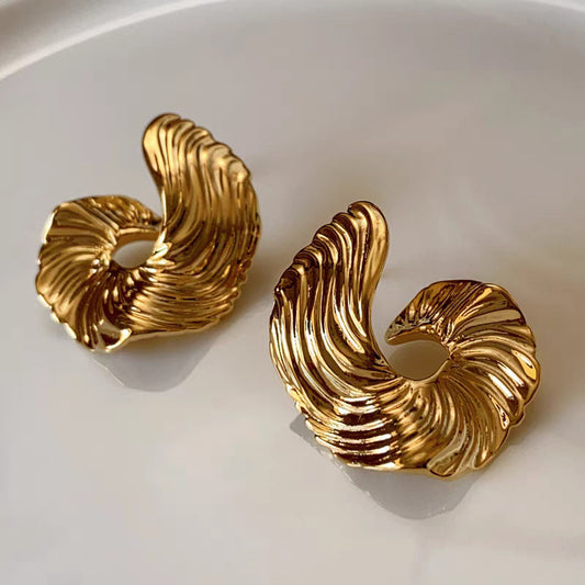A girl with a unique and distinctive design of ear studs