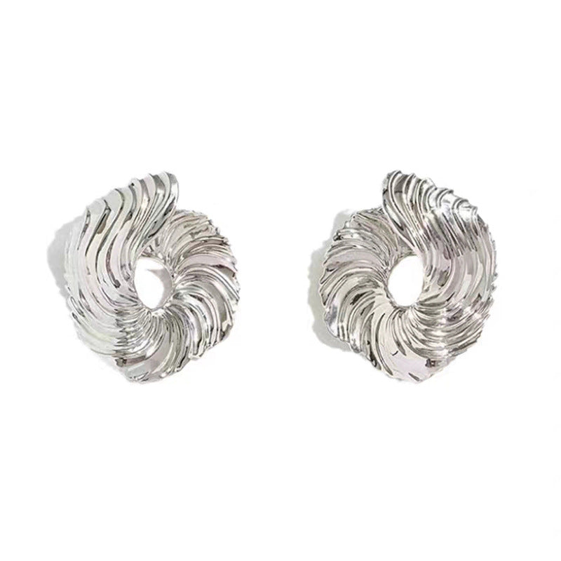 A girl with a unique and distinctive design of ear studs