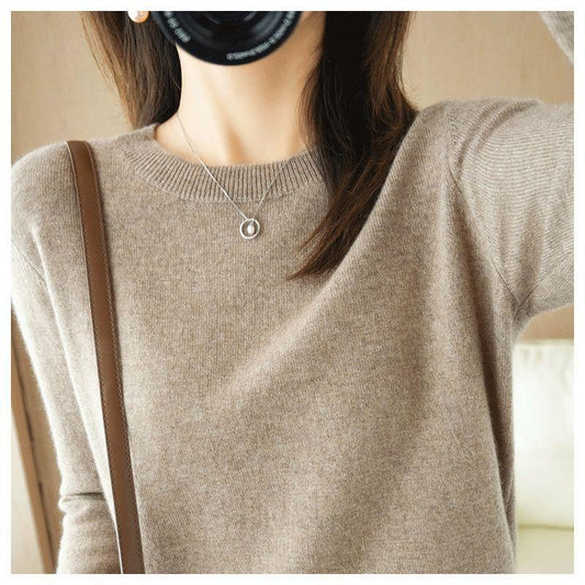 A large-sized top with a round-neck sweater as the base layer
