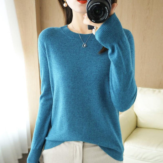 A large-sized top with a round-neck sweater as the base layer