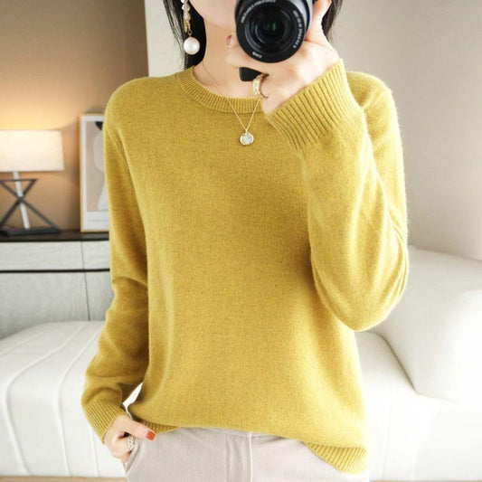 A large-sized top with a round-neck sweater as the base layer