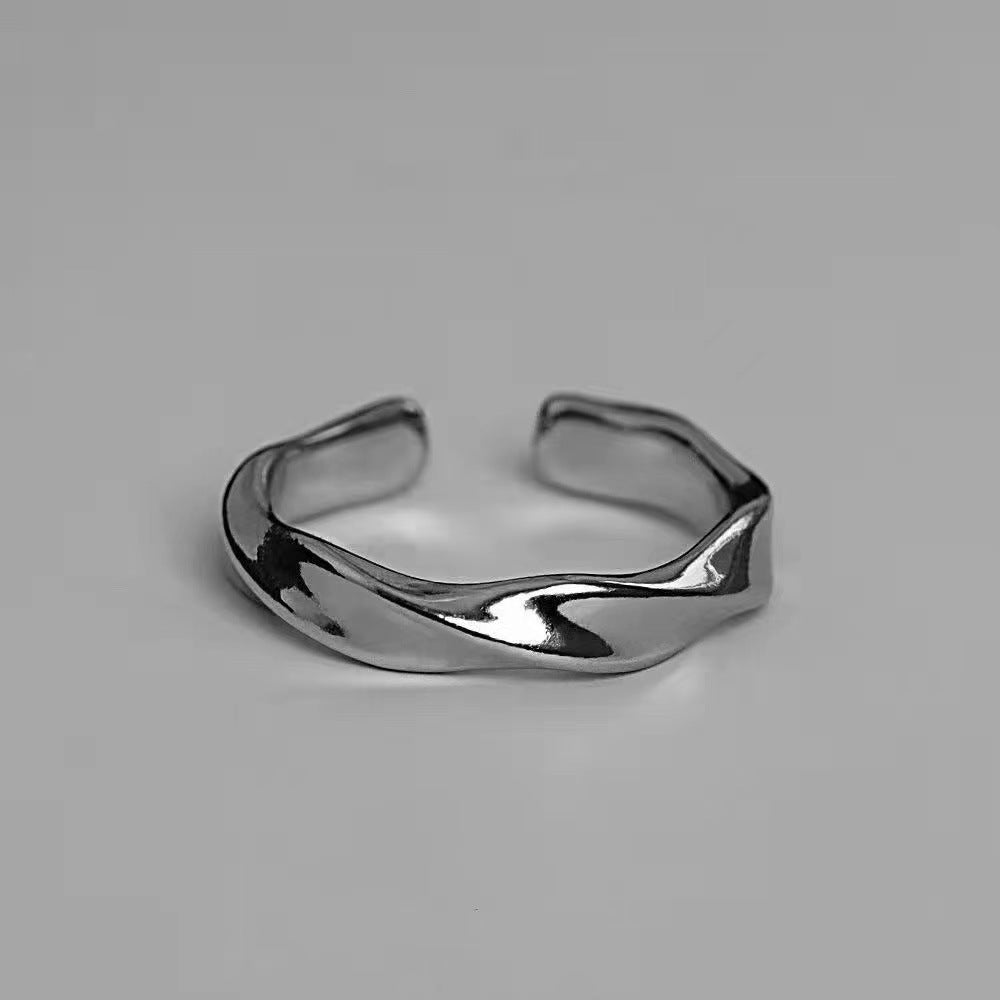 A man wearing a Mobius strip ring