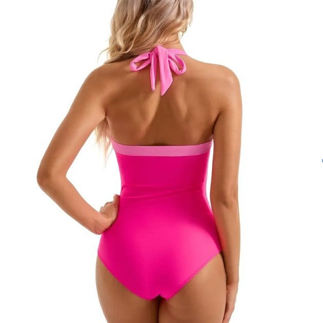 A one-piece swimsuit with a cinched belly and a halter top
