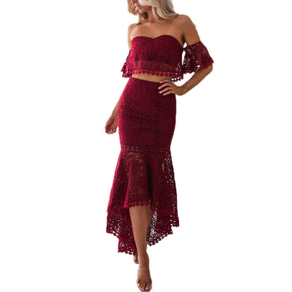 A pencil skirt with a strapless, exposed back, cinched waist and trailing tail