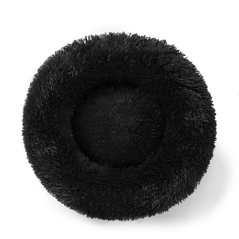A plush round pet bed