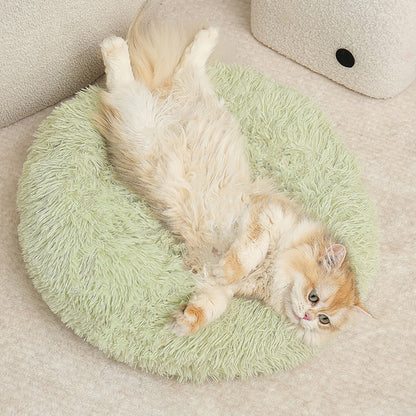 A plush round pet bed