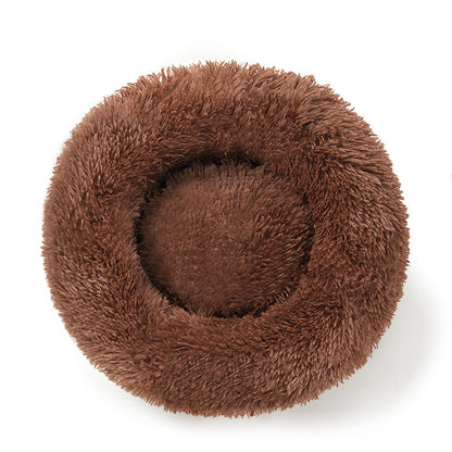 A plush round pet bed