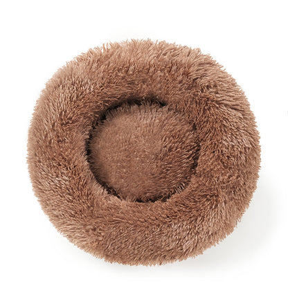 A plush round pet bed
