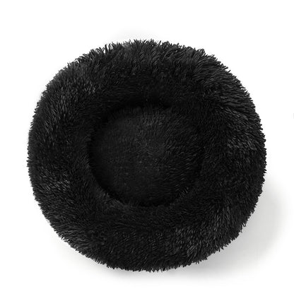 A plush round pet bed