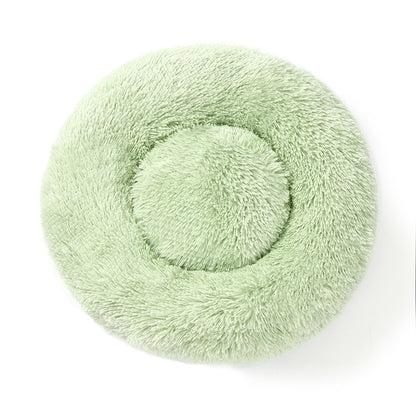 A plush round pet bed