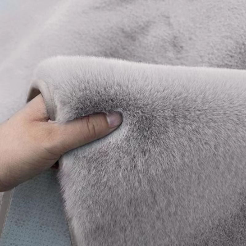 A rabbit-shaped plush coffee table mat