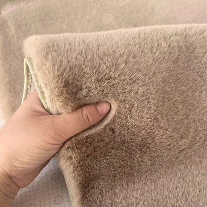 A rabbit-shaped plush coffee table mat