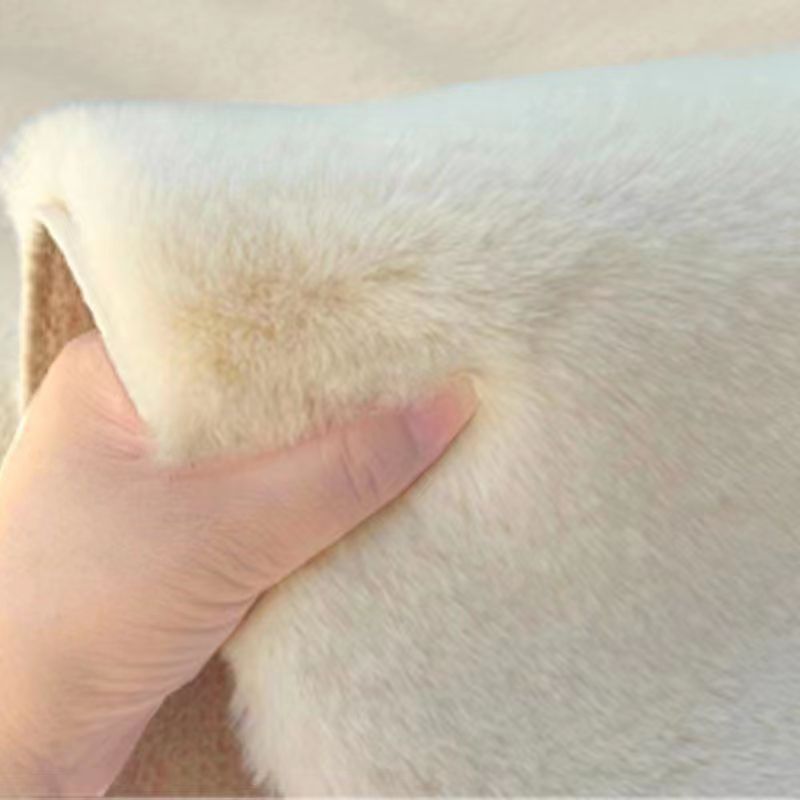 A rabbit-shaped plush coffee table mat
