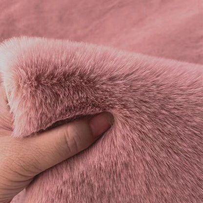 A rabbit-shaped plush coffee table mat