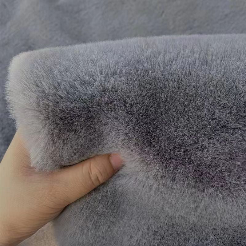 A rabbit-shaped plush coffee table mat