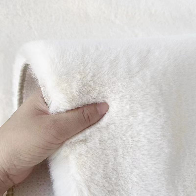 A rabbit-shaped plush coffee table mat