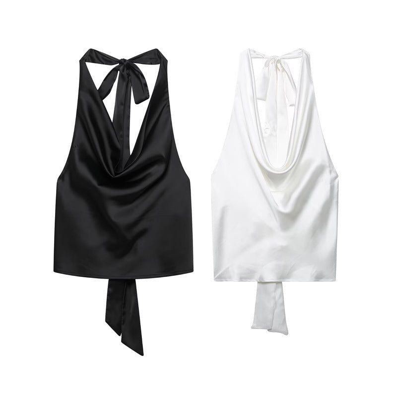 A silk satin-textured top hung around the neck