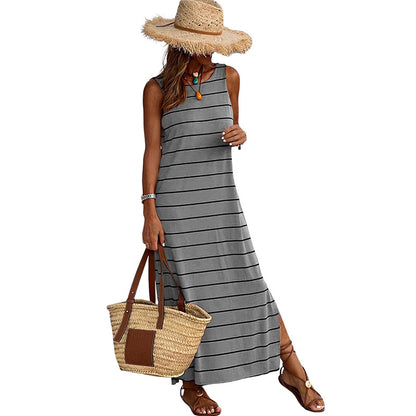 A sleeveless, high-waisted, form-fitting, low-necked long dress
