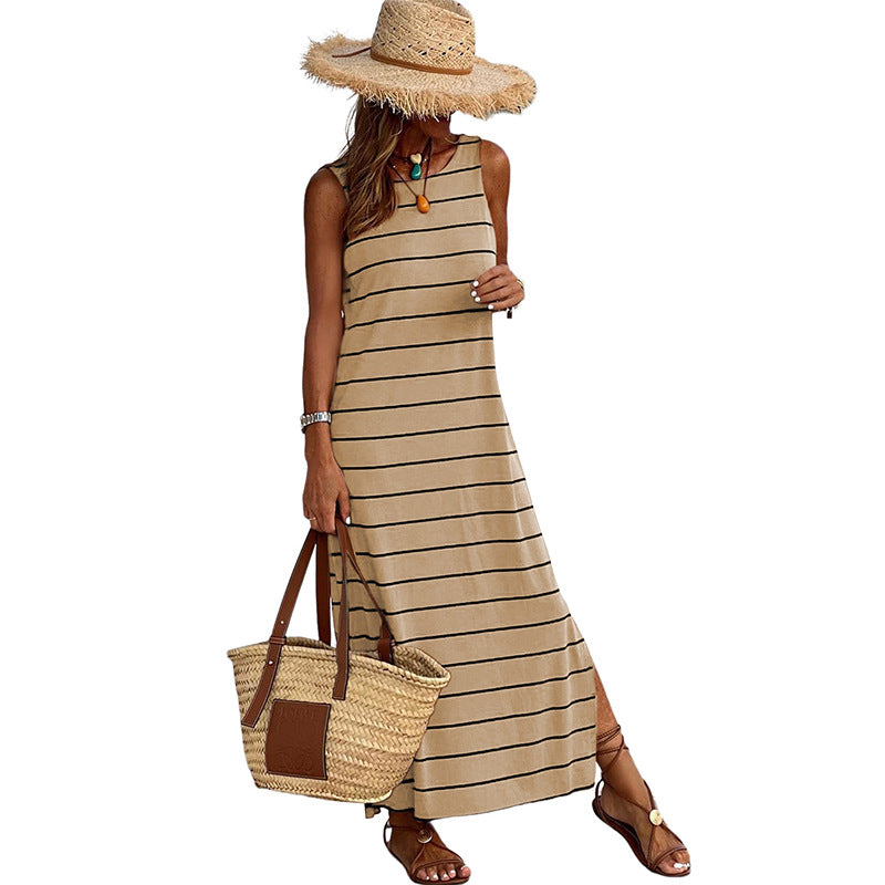 A sleeveless, high-waisted, form-fitting, low-necked long dress