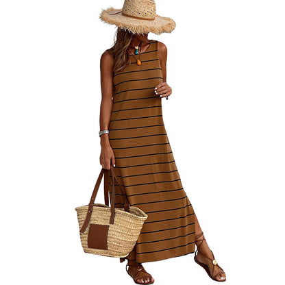 A sleeveless, high-waisted, form-fitting, low-necked long dress