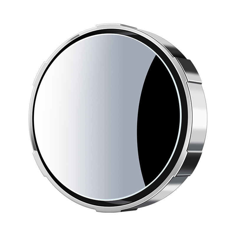 A small round car rearview mirror with a suction cup