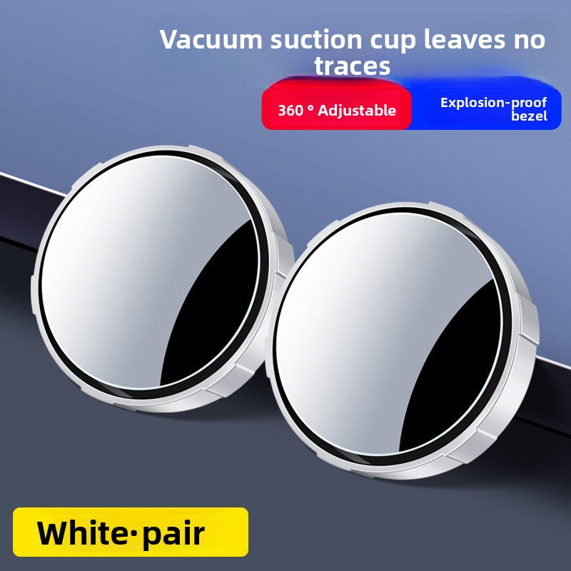 A small round car rearview mirror with a suction cup