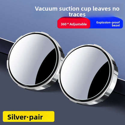 A small round car rearview mirror with a suction cup