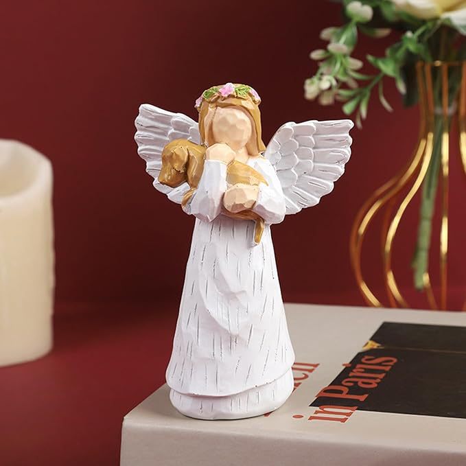 A souvenir table ornament of the Angel holding a dog