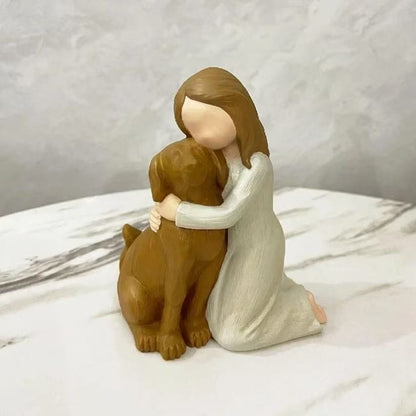 A souvenir table ornament of the Angel holding a dog