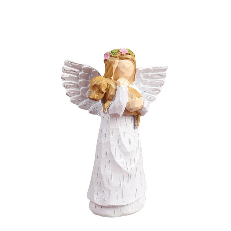 A souvenir table ornament of the Angel holding a dog
