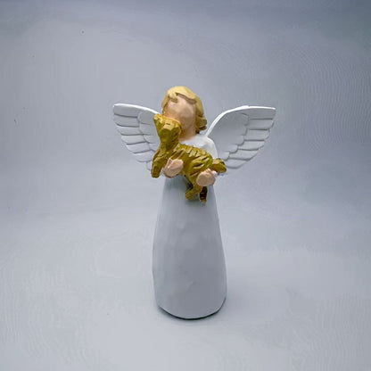 A souvenir table ornament of the Angel holding a dog