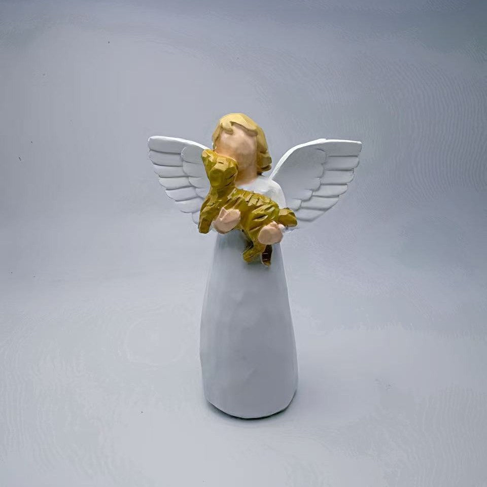A souvenir table ornament of the Angel holding a dog