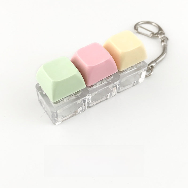 A squeezable charm pendant
