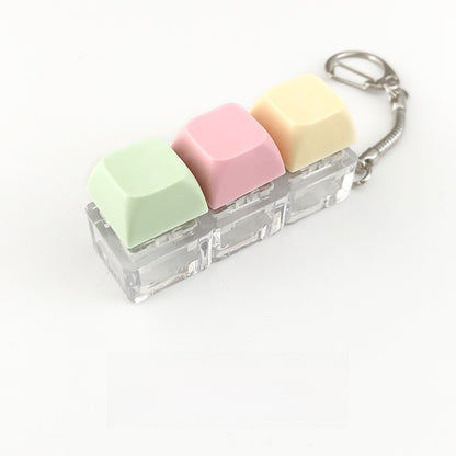 A squeezable charm pendant