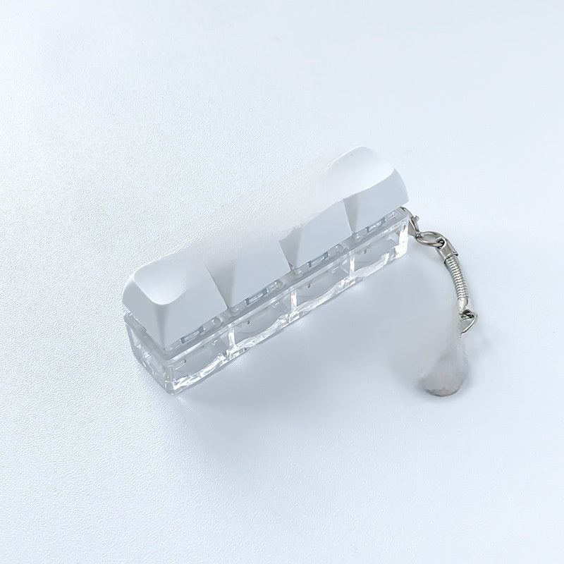 A squeezable charm pendant