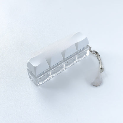A squeezable charm pendant