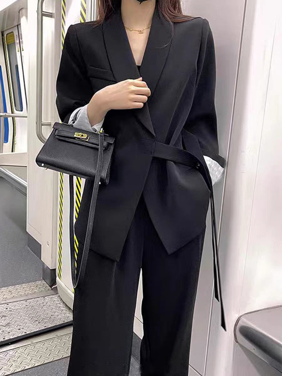 A two-piece suit jacket and wide-leg pants
