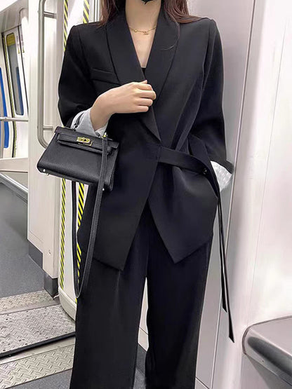 A two-piece suit jacket and wide-leg pants