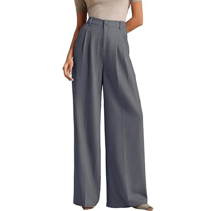 A woman in a high-waisted suit pants
